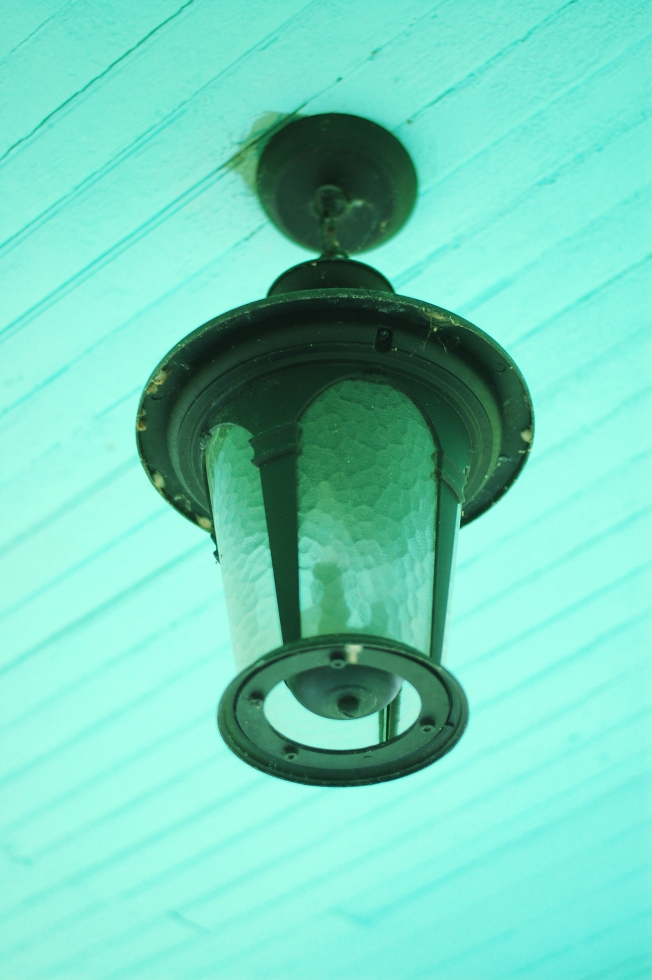 The front porch lamp. The ceiling of the porch is painted "haint blue" which is said to ward off evil spirits and bugs. :)